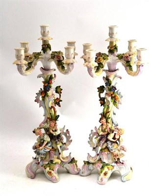 Lot 134 - A pair of Continental porcelain candelabra