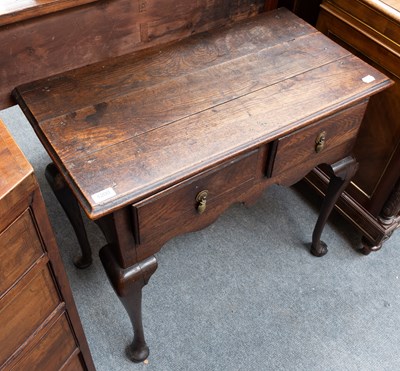Lot 1200 - A George II Provincial Oak Low Boy, fitted...