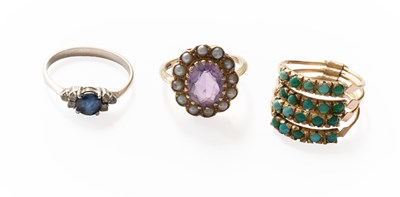 Lot 321 - A Sapphire and Cubic Zirconia Ring, finger...