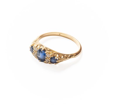 Lot 302 - A Sapphire and Diamond Seven Stone Ring, an...