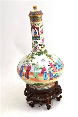 Lot 145 - A 19th century Chinese shaft and globe porcelain vase, with cover (damaged) on wood stand