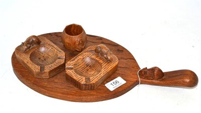 Lot 156 - A Mouseman cheese board, two Mouseman ashtrays and a Mouseman napkin ring