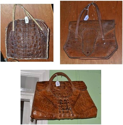 Lot 180 - Circa 1940's tan leather crocodile handbag and two others (3)