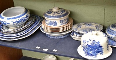 Lot 184 - Shelf of assorted blue and white pottery, Oriental circular bowl, cheese stands, tureens, etc