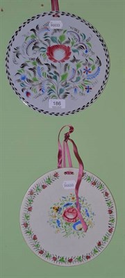 Lot 186 - Victorian circular wall plaque decorated with flowers and another smaller