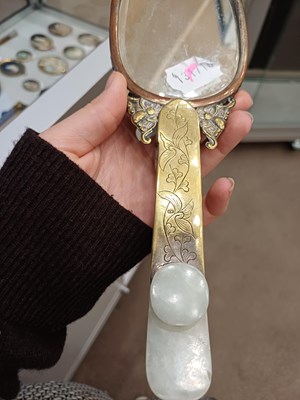 Lot 78 - A Chinese Jade-Mounted Hand Mirror, the jade...
