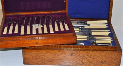 Lot 195 - An oak cased canteen of cutlery and a set of fish knives, cased