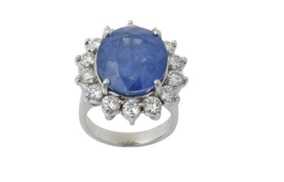 Lot 2328 - A Sapphire and Diamond Cluster Ring the oval...
