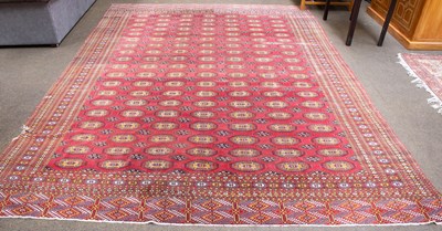 Lot 1303 - Afghan "Bukhara" Carpet, the strawberry field...