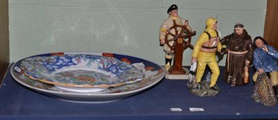 Lot 203 - Four Royal Doulton figures; The Jovial Monk, Lifeboat Man, Sea Harvest and The Helmsman; large...