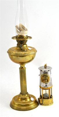 Lot 210 - A miner's lamp and an oil lamp