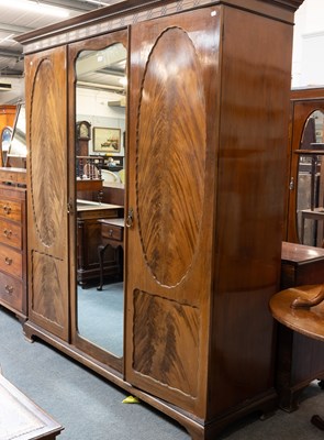 Lot 1194 - An Early 20th Century Mirrored Triple Wardrobe,...