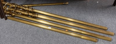 Lot 229 - A Set of Four Reeded Brass Curtain Poles, a...