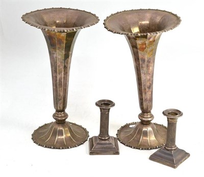 Lot 234 - Two silver plated vases and two silver candlesticks