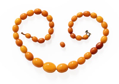Lot 307 - A Graduated Amber Bead Necklace, length 59cm...
