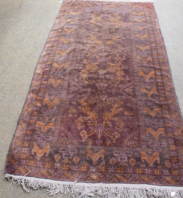 Lot 1304 - Baluch Rug, the aubergine field containing...