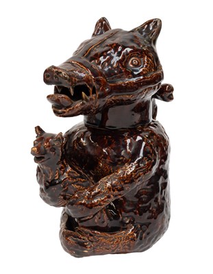 Lot 50 - A Staffordshire Treacle Glazed Bear Jug and...