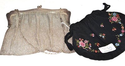 Lot 303 - Silver mesh purse stamped '925' and a black drawstring evening purse with embroidered floral...