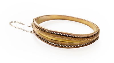 Lot 323 - A 9 Carat Gold Hinged Bangle, inner...
