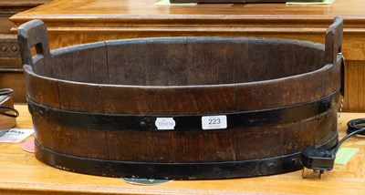 Lot 223 - A Staved Oak Planter, of ovoid form, with loop...