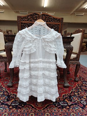 Lot 244 - An Edwardian white lace trimmed dress,...