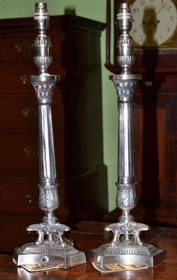 Lot 324 - A pair of silver plated Empire style table lamps