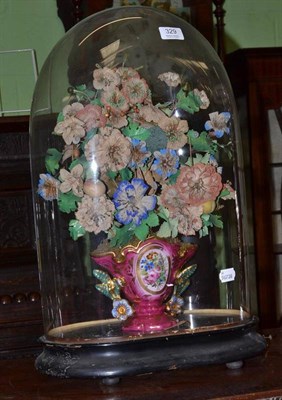 Lot 329 - Musical mechanical dome and stand with pink ground porcelain vase and flowers