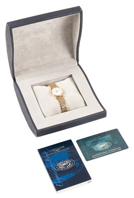 Lot 2494 - Longines: A Lady's Bi-Metal Wristwatch, signed...