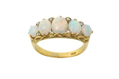 Lot 2383 - An Opal Five Stone Ring three graduated oval...