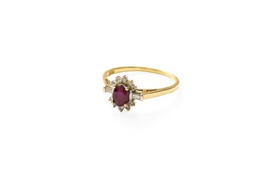 Lot 342 - A Red Stone and Diamond Cluster Ring, the oval...