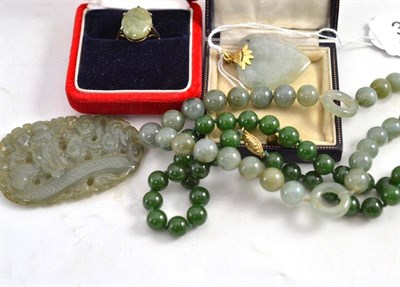 Lot 337 - A 9ct gold jade type ring, a heart shaped pendant, a jade type bead necklace and a pair of earrings