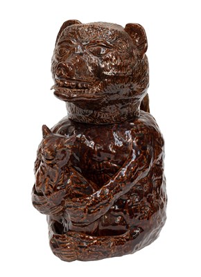 Lot 49 - A Staffordshire Treacle Glazed Pottery Bear...