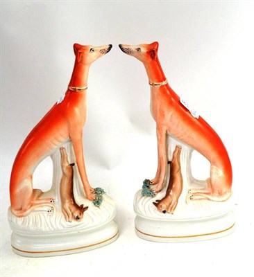 Lot 341 - Pair of seated Staffordshire greyhounds