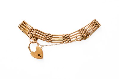 Lot 316 - A Gate Link Bracelet, stamped '9CT', with a...