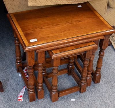 Lot 1350 - A 20th Century Cross Banded Oak Nest of Tables,...