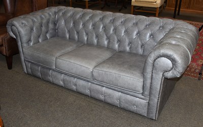 Lot 1436 - A Grey Leather Buttoned Chesterfield Sofa,...