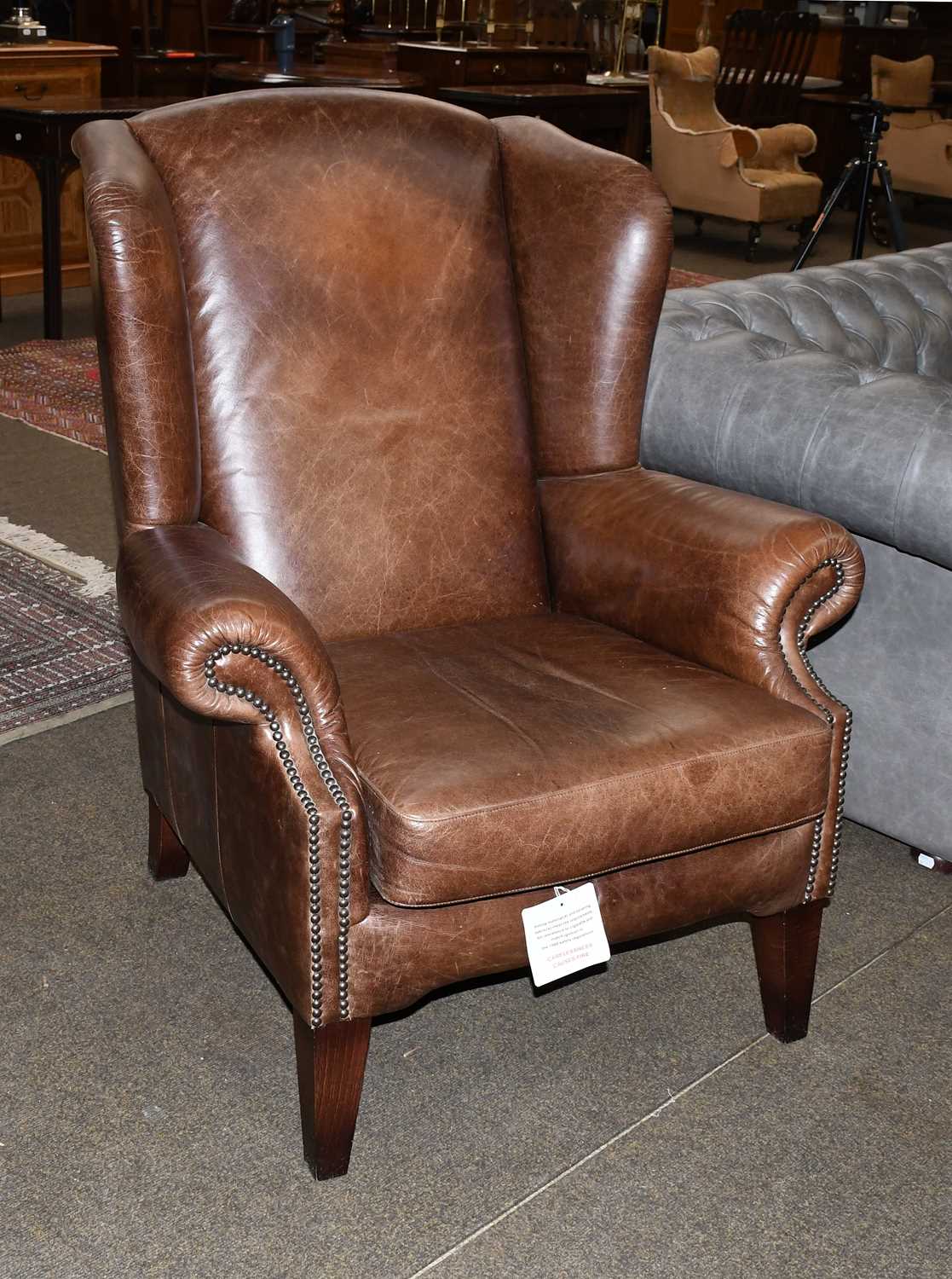 Lot 1437 - A Tetrad Brown Leather Wing Armchair