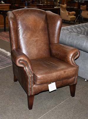 Lot 1437 - A Tetrad Brown Leather Wing Armchair