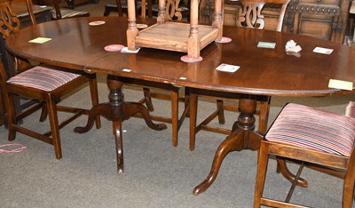 Lot 1444 - An Oak Dining Table, 20th century, on twin...