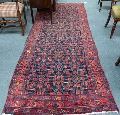 Lot 1125 - Kurdish Long Rug, the indigo Herati field...