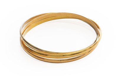 Lot 318 - A Tri-Colour Bangle, stamped '750', inner...