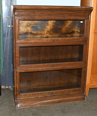 Lot 1468 - An Oak Globe Wernicke Style Three Tier...