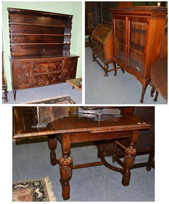 Lot 429 - An oak dresser and rack, an oak bureau, a mahogany glazed display cabinet and an oak draw leaf...