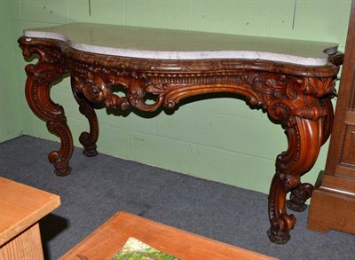 Lot 434 - Large carved mahogany serpentine fronted console table with marble top