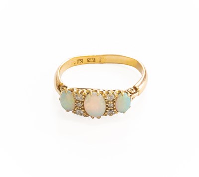 Lot 379 - An Opal and Diamond Ring, three oval cabochon...
