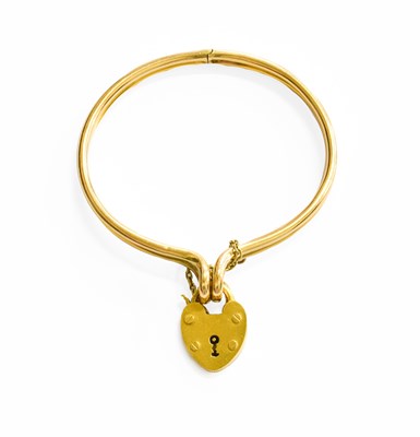 Lot 357 - A Hinged Bangle, front fastening, with a heart...