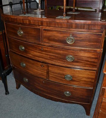 Lot 444 - A Georgian mahogany bow fronted four height chest of drawers