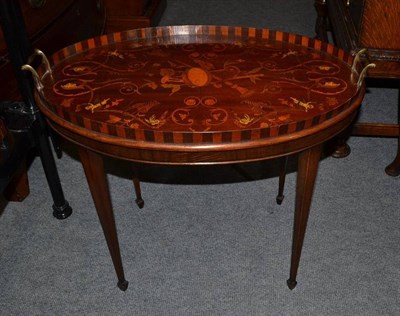 Lot 445 - A 19th century mahogany inlaid oval tea tray on a later stand