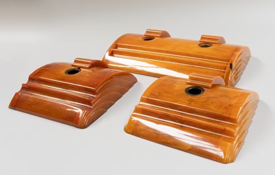 Lot 237 - An Art Deco Amber Bakelite Twin Well Desk...
