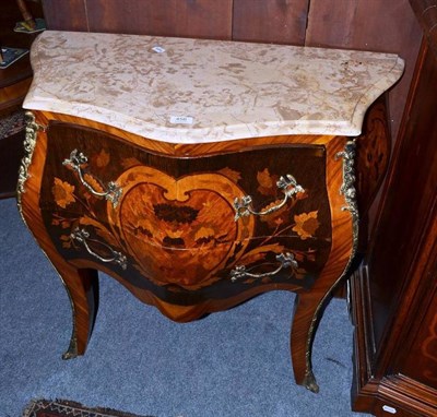 Lot 456 - A French inlaid bombe commode with gilt metal mounts and marble top